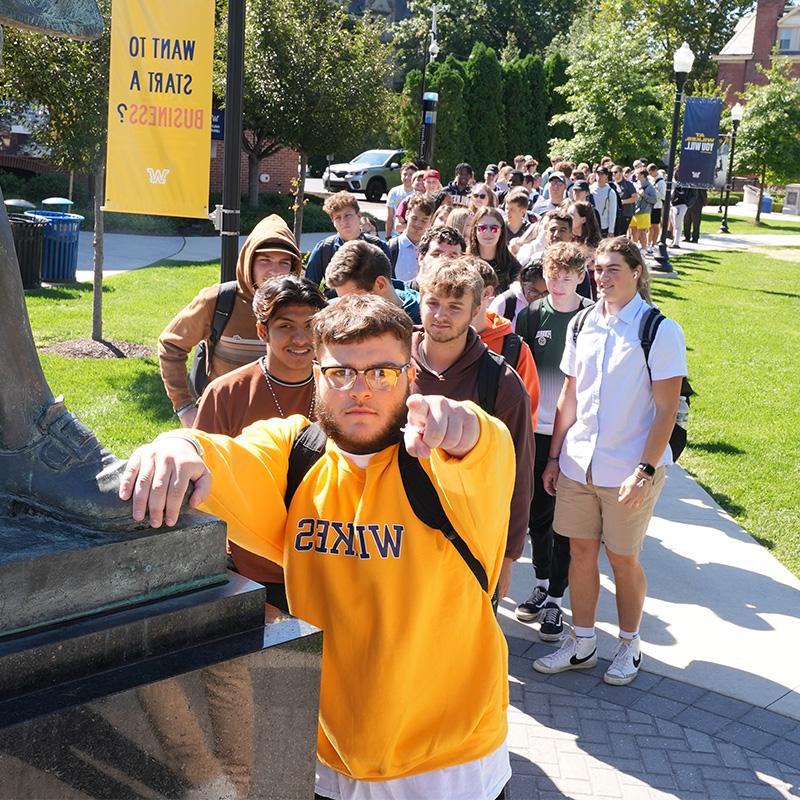 Wilkes students using a laptop